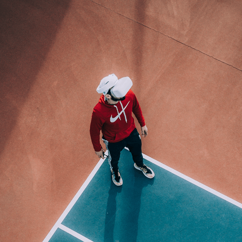Man wearing VR headset on basketball court