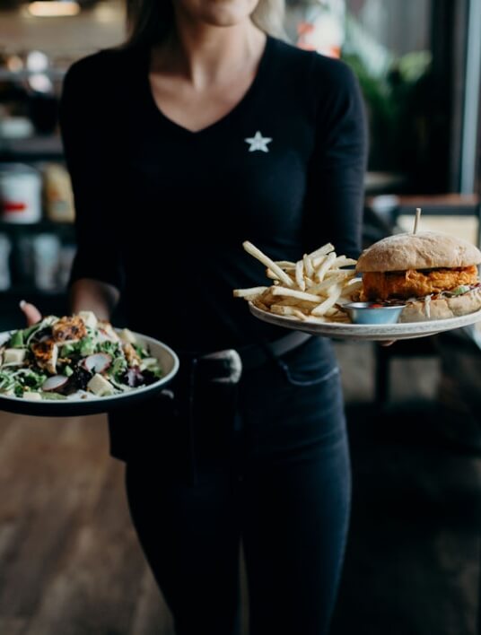 Server bringing food to a table