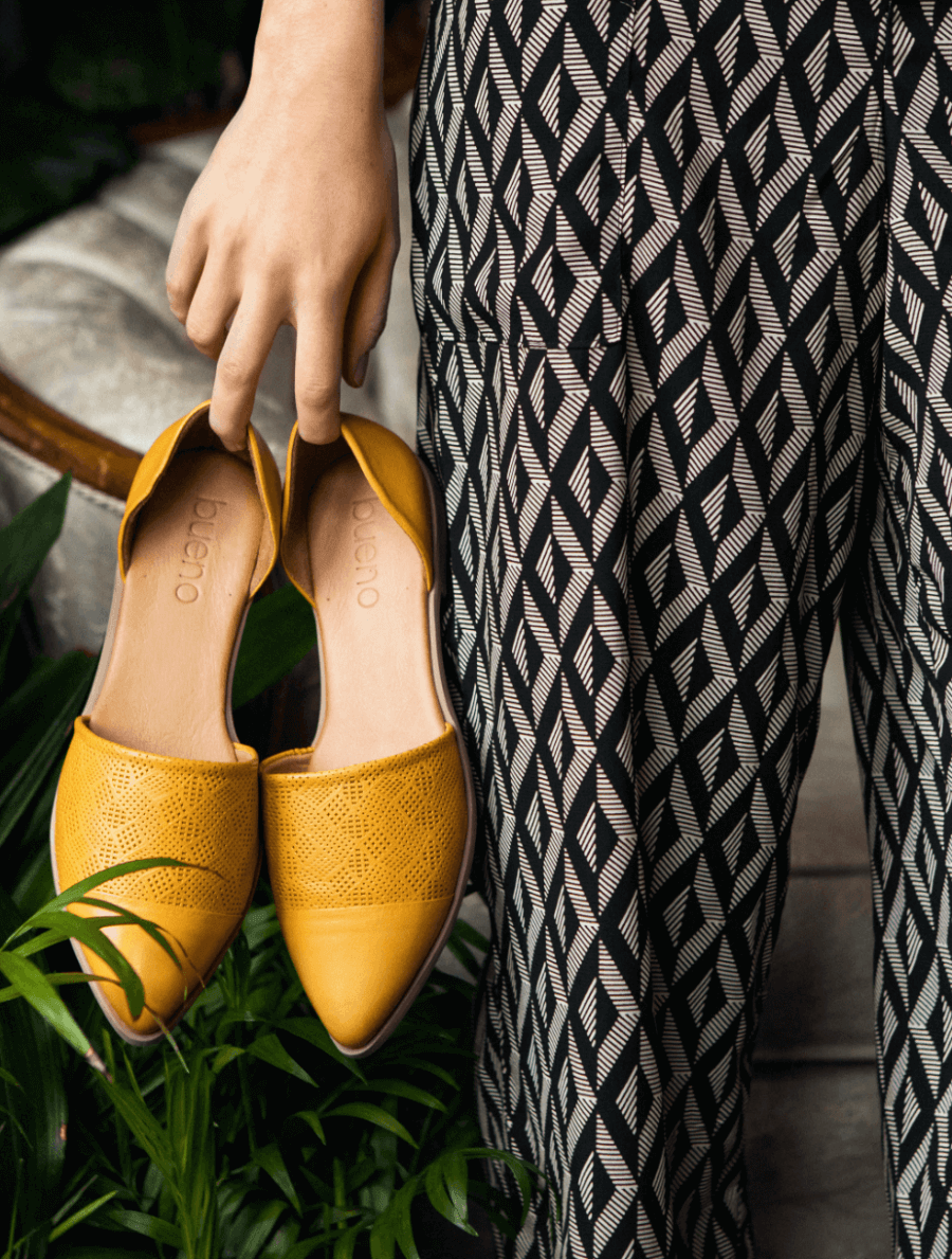 Woman holding Ketch shoes.
