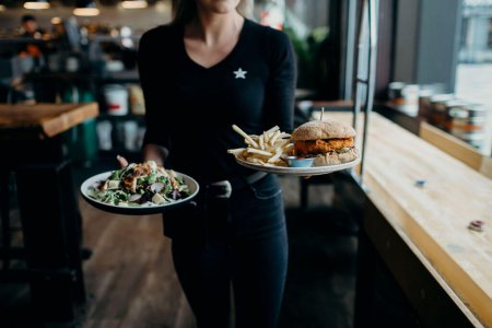Server delivering food to a table