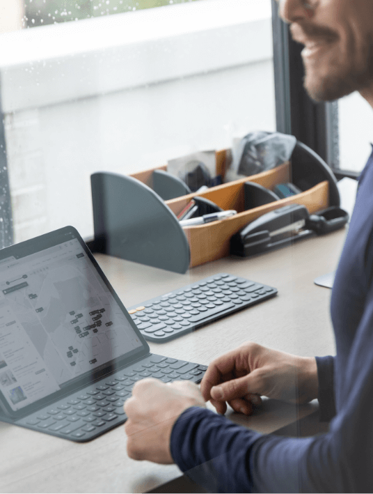 Man looking at map on computer