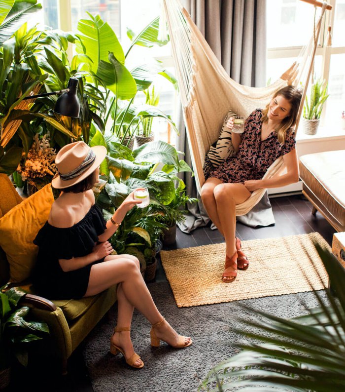 Two women sitting and talking in a living room